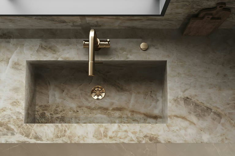 Stone basin extending the floor material in a French Mediterranean bathroom.