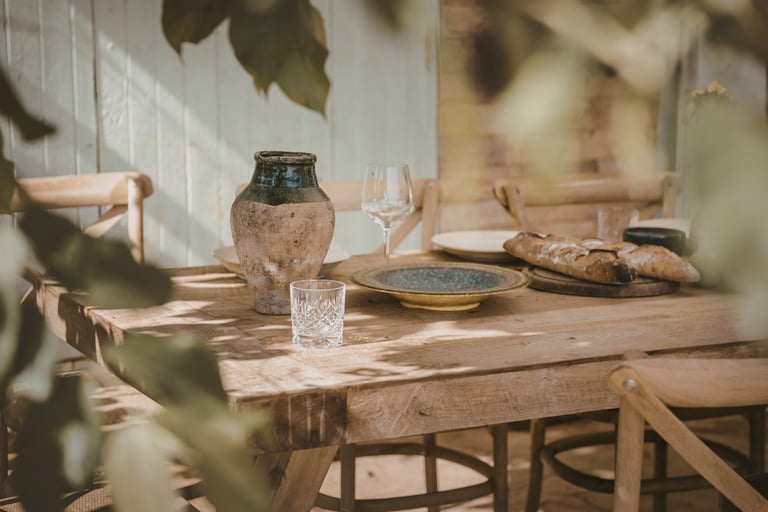 A French Medite.rranean dining room in seasonal warm light