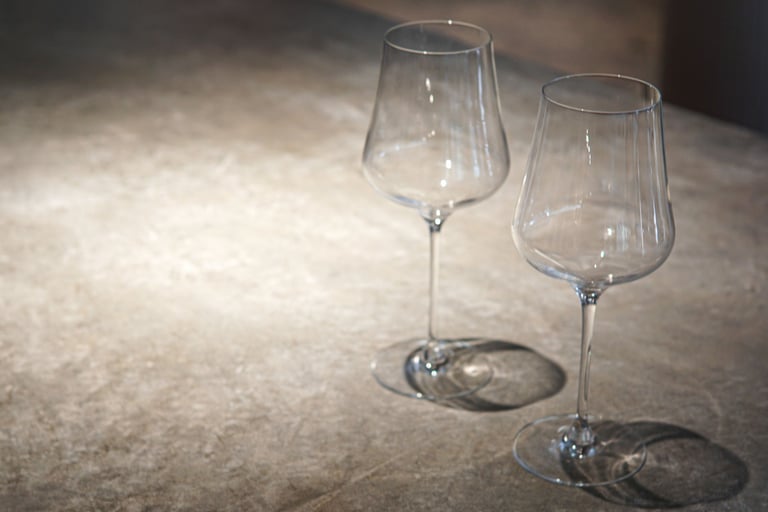 Honed stone dining tabletop in a French Mediterranean room.