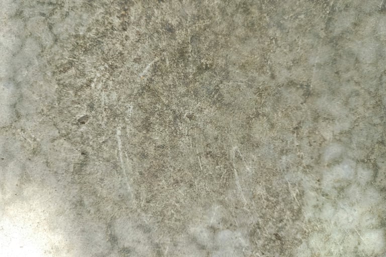 Honed stone kitchen worktop with soft veining and natural patina.