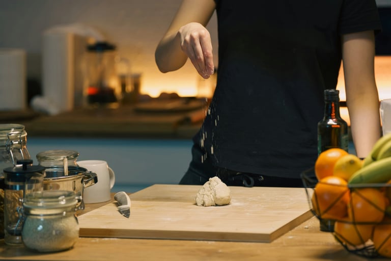 Hands working at a correctly proportioned French Mediterranean kitchen counter.