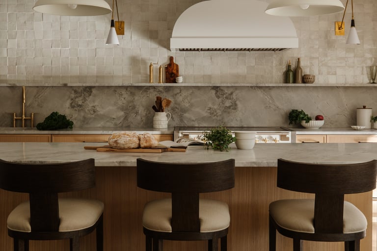Kitchen island aligned with the main counter in a French Mediterranean kitchen.