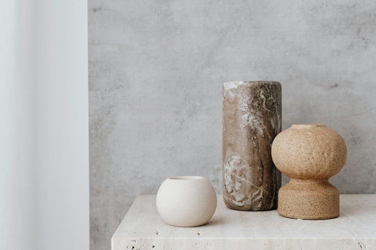 Warm tonal palette in a French Mediterranean living room —earthty tones against stone