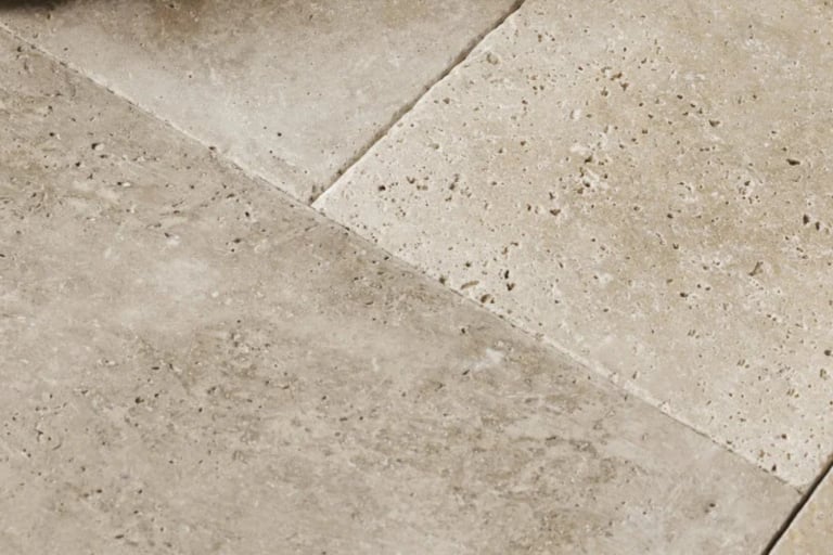 Honed limestone in a French Mediterranean living room.