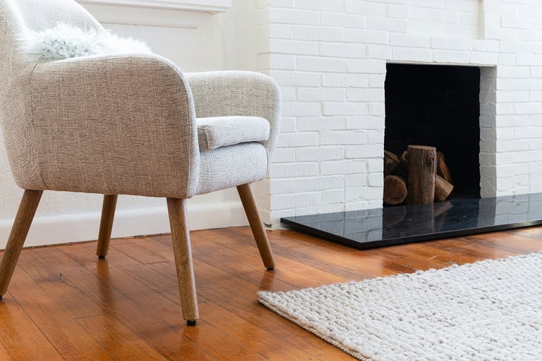 Seating arrangement with negative space in a French Mediterranean living room.