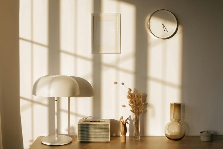 Midday light with short shadows across the pale surfaces of a Mediterranean room