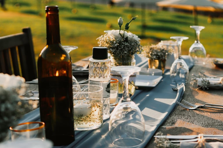 Dinner table in a French Mediterranean garden at the hour of use.