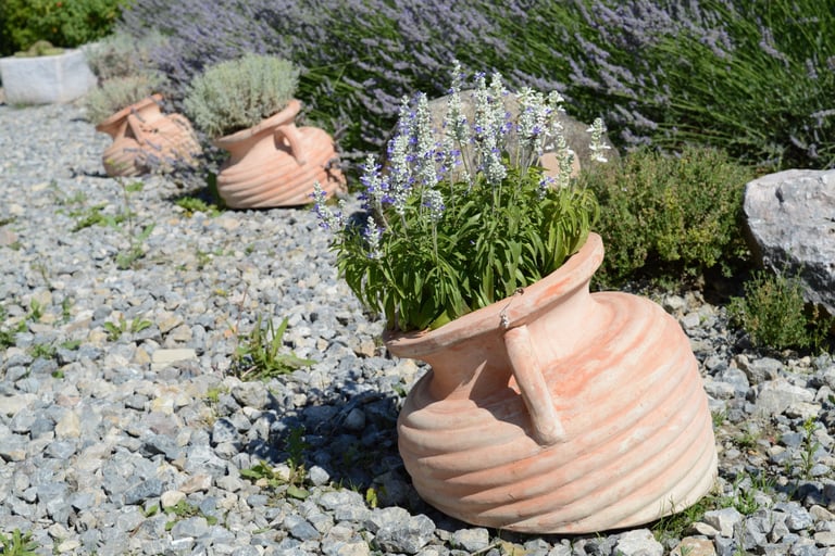 Weathered terracotta in a French Mediterranean garden.