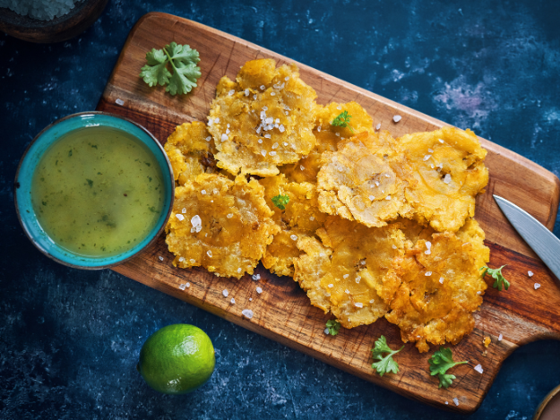 a board with tostones and mojo boricua