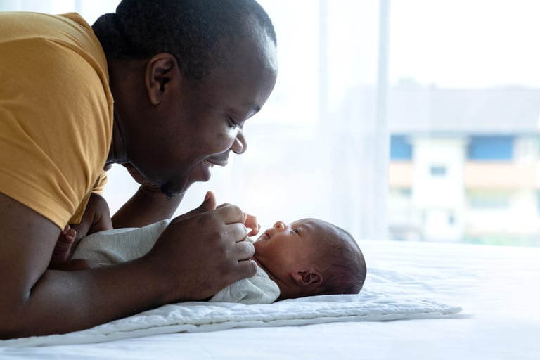 Dad playing with baby
