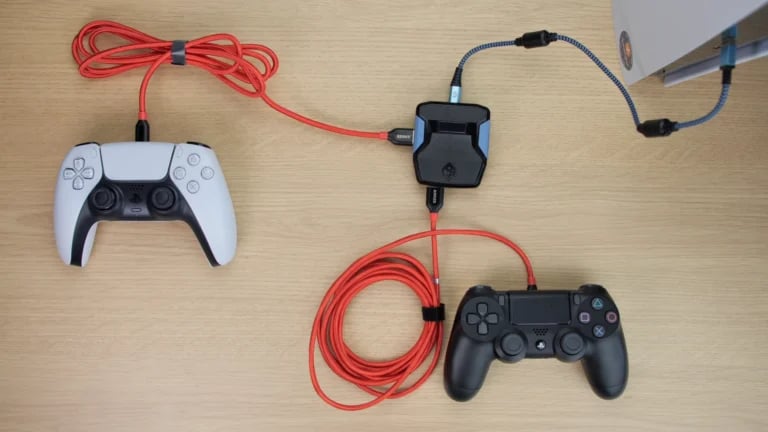 a couple of controllers and a controller on a table