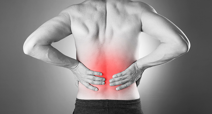 a man with a back pain in a pain