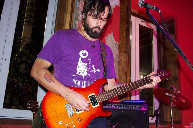 a man with a guitar and a guitar