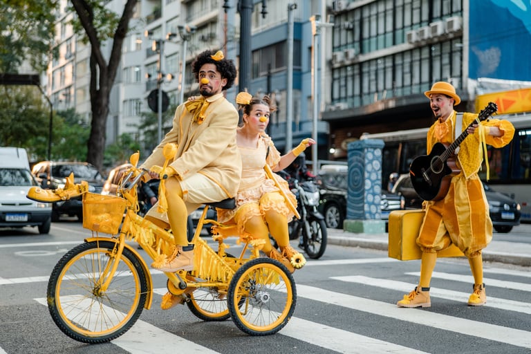 a man in a yellow outfit is riding a bicycle