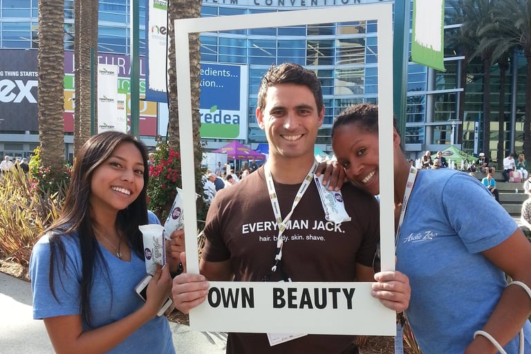 smiling brand ambassadors pose for photo with guests