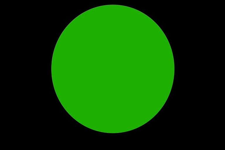 Green dot on a black background