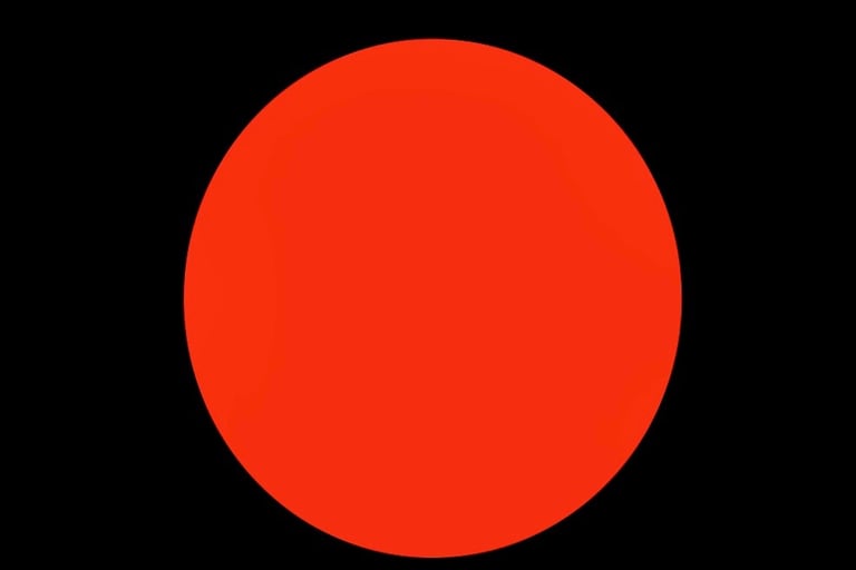 Red dot on a black background