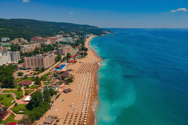 a beach with a view of a beach and a blue sky