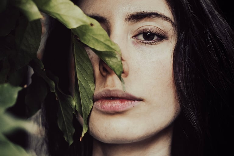 a woman with long hair and a white shirt