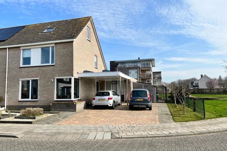 a house with a car parked in front of it