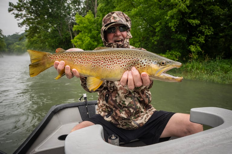 Check out Chris with this huge brown that ate a streamer!