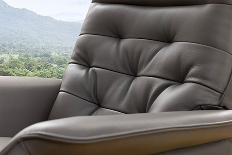 a chair with a view of a mountain in the background