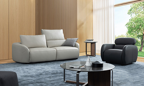 a living room with a couch and a chair