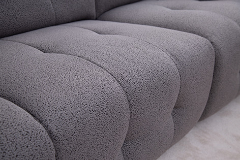 a couch with a cat sitting on top of it