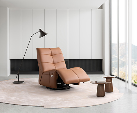 a chair with a lamp on it and a lamp on the floor