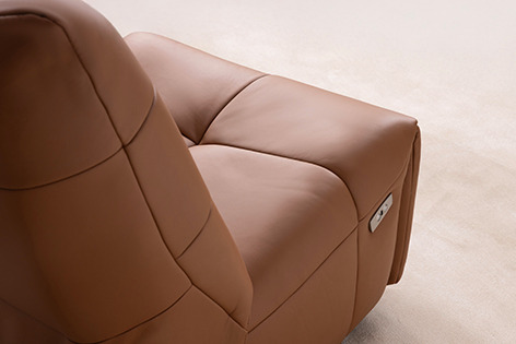 a brown leather reclining chair with a brown leather reclining chair
