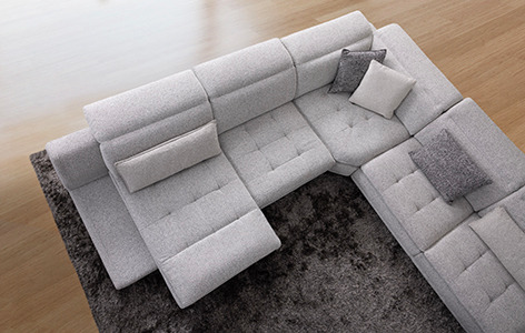 a couch with a large sectional couch and a rug
