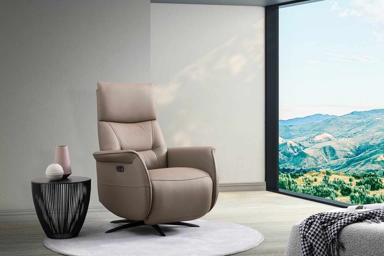 a chair with a large window and a view of a mountain