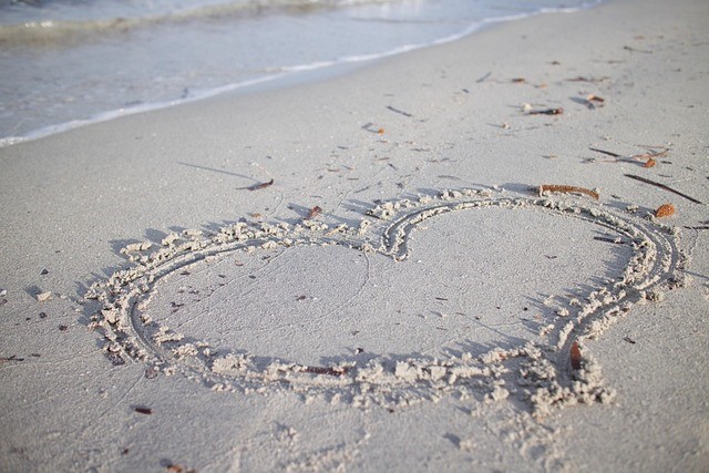 a shaped heart drawn in the sand