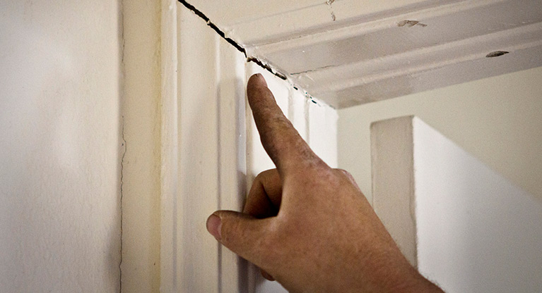 broken door frame as a sign of foundation issues