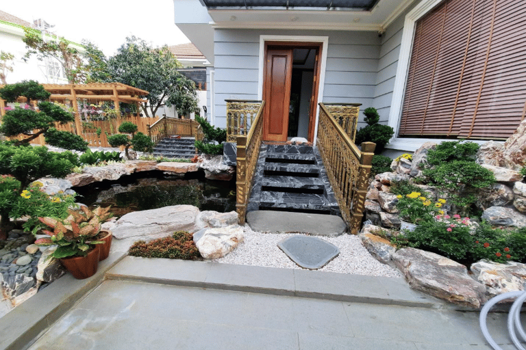 a house with a waterfall in the front yard