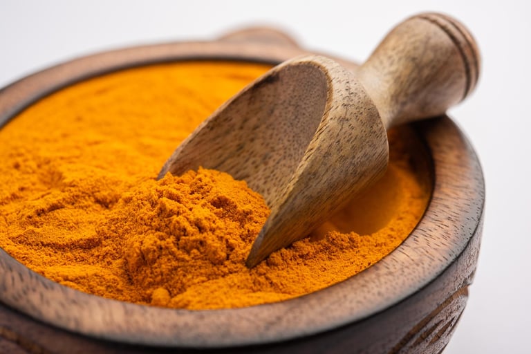 Turmeric powder in a wooden bowl