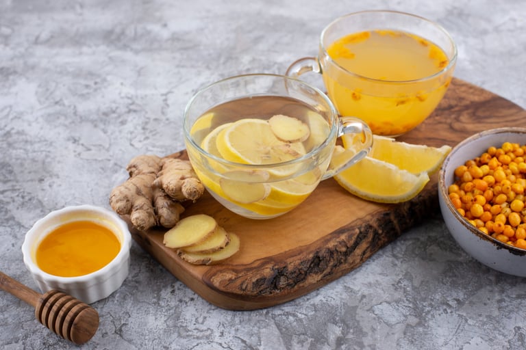Turmeric, lemon, and ginger detox water in two cups