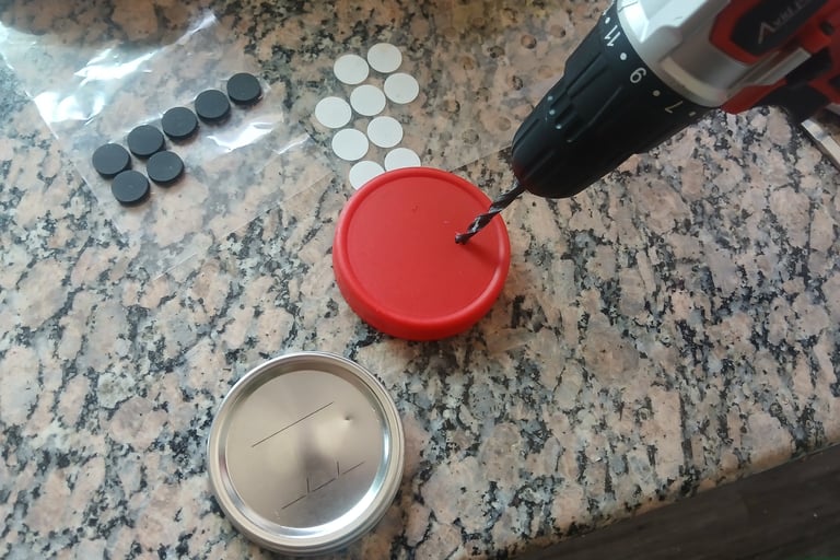 Close-up of drilling a hole into a jar lid for a DIY mycology lid.
