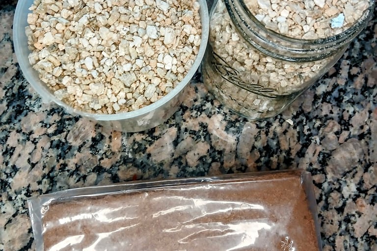 Two jars of vermiculite and a brick of coco coir for mushroom bulk substrate preparation