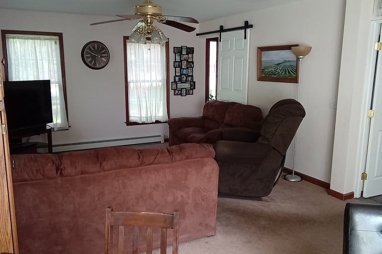 family room with barn door to foyer