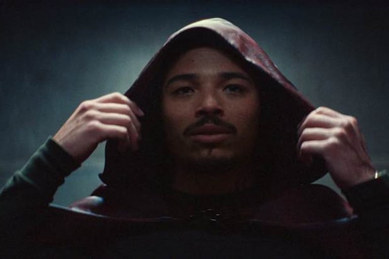 a man in a hoodie with a hoodie on
