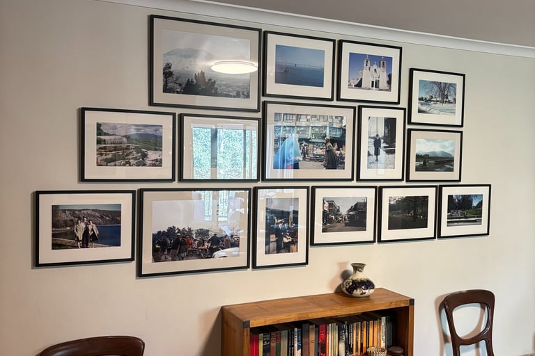 a gallery style art hanging with a cluster of family photographs