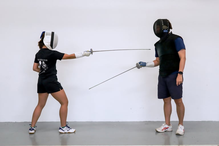 a woman having individual fencing lesson