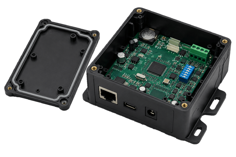 PCB circuit board alongside its matching custom injection-molded plastic enclosure 