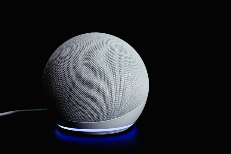 Futuristic white smart speaker with glowing lights in dark background