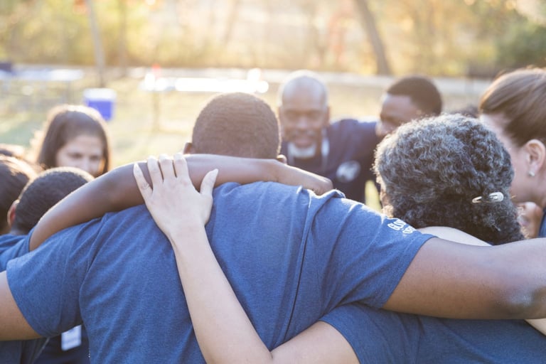 a group of PACE family members standing in a circle