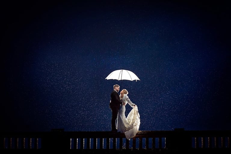 Wedding bride and groom in rain