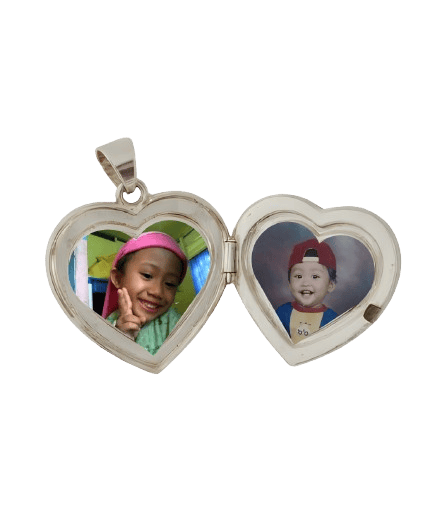Open heart-shaped silver locket pendant featuring two colorful photos of young children.