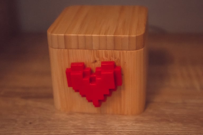a wooden block heart shaped puzzle box glovebox