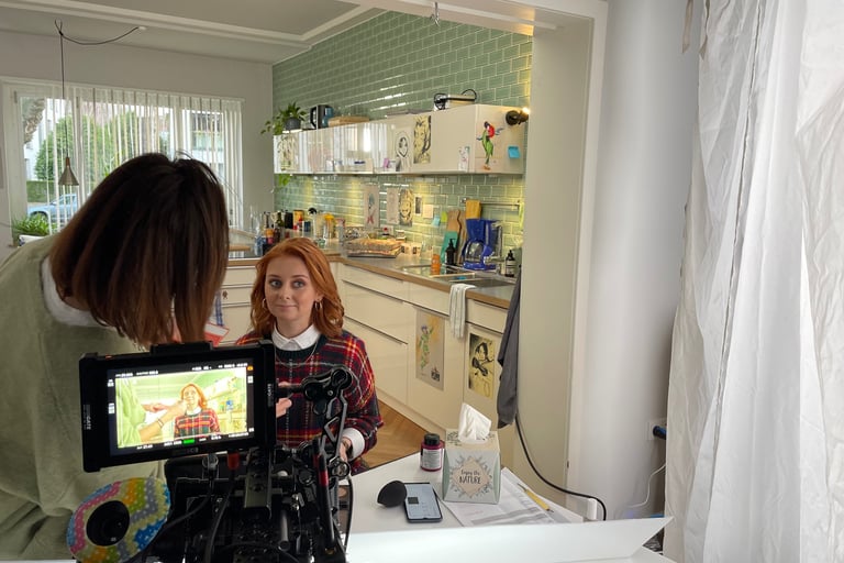 a woman is filming a video camera and a video camera